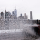A worker blasting some dirty-ass snow